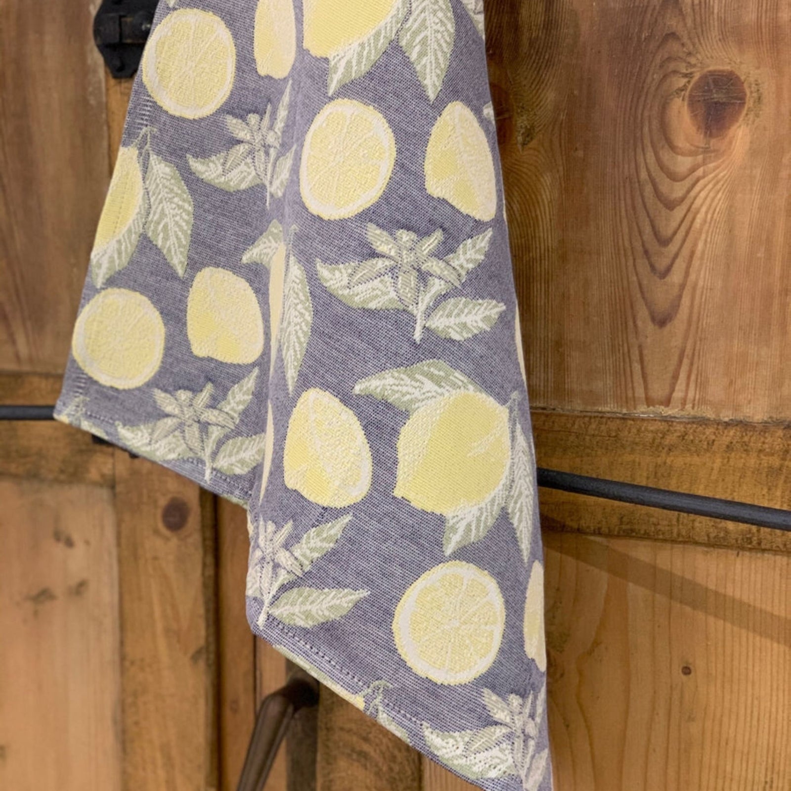 Busatti Lemon Kitchen Towel from My Italian Decor, made in Italy, featuring bright yellow lemon print on soft table linen fabric.