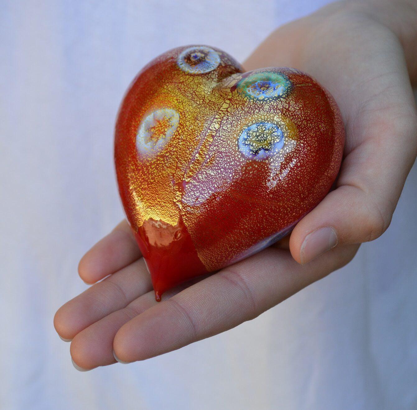 Colorful Murano Glass blown heart figurine with millefiori patterns, showcasing vibrant mixed colors and intricate glass craftsmanship.