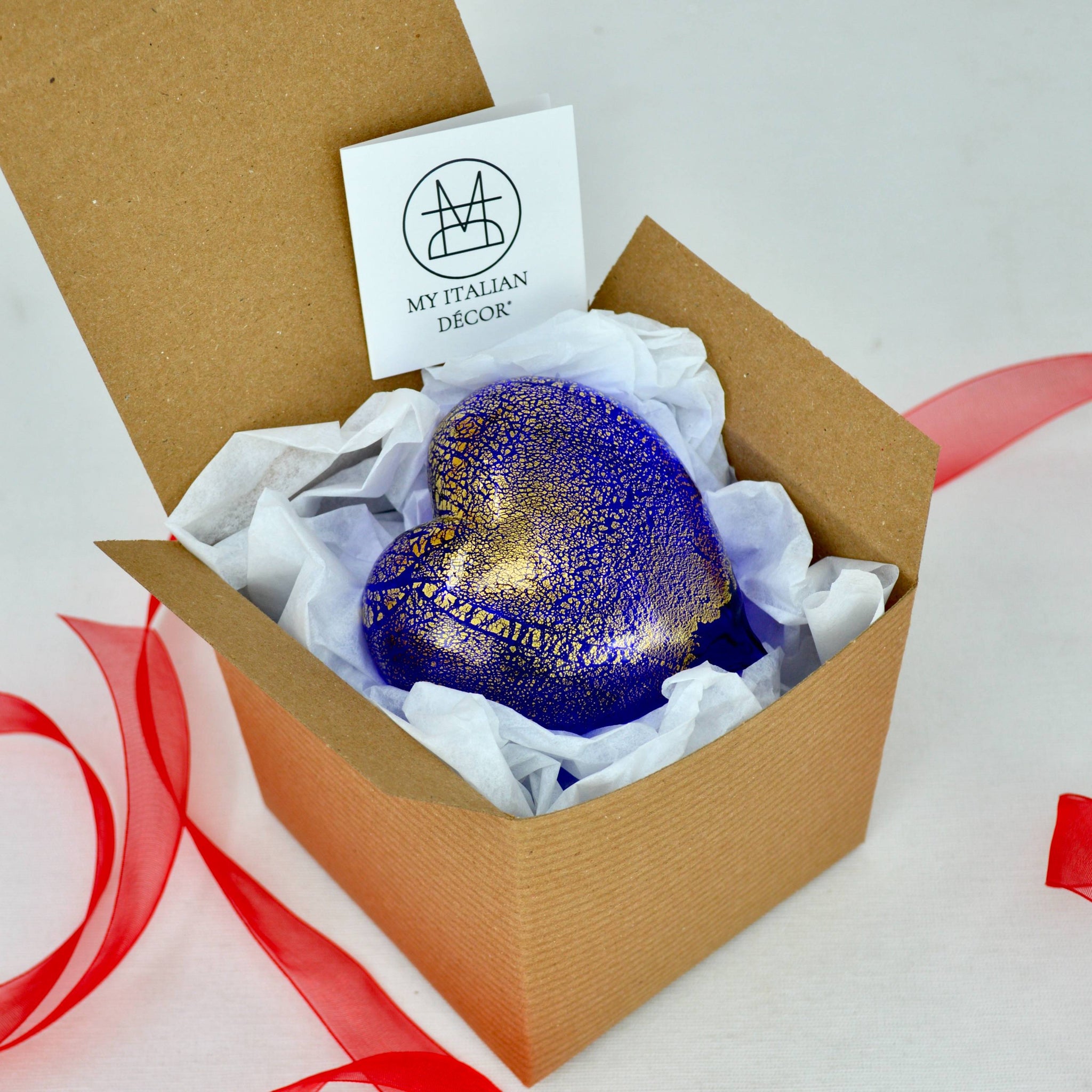 Cobalt Murano glass heart figurine with 24-karat gold accents, handmade in Italy, displayed in a box.