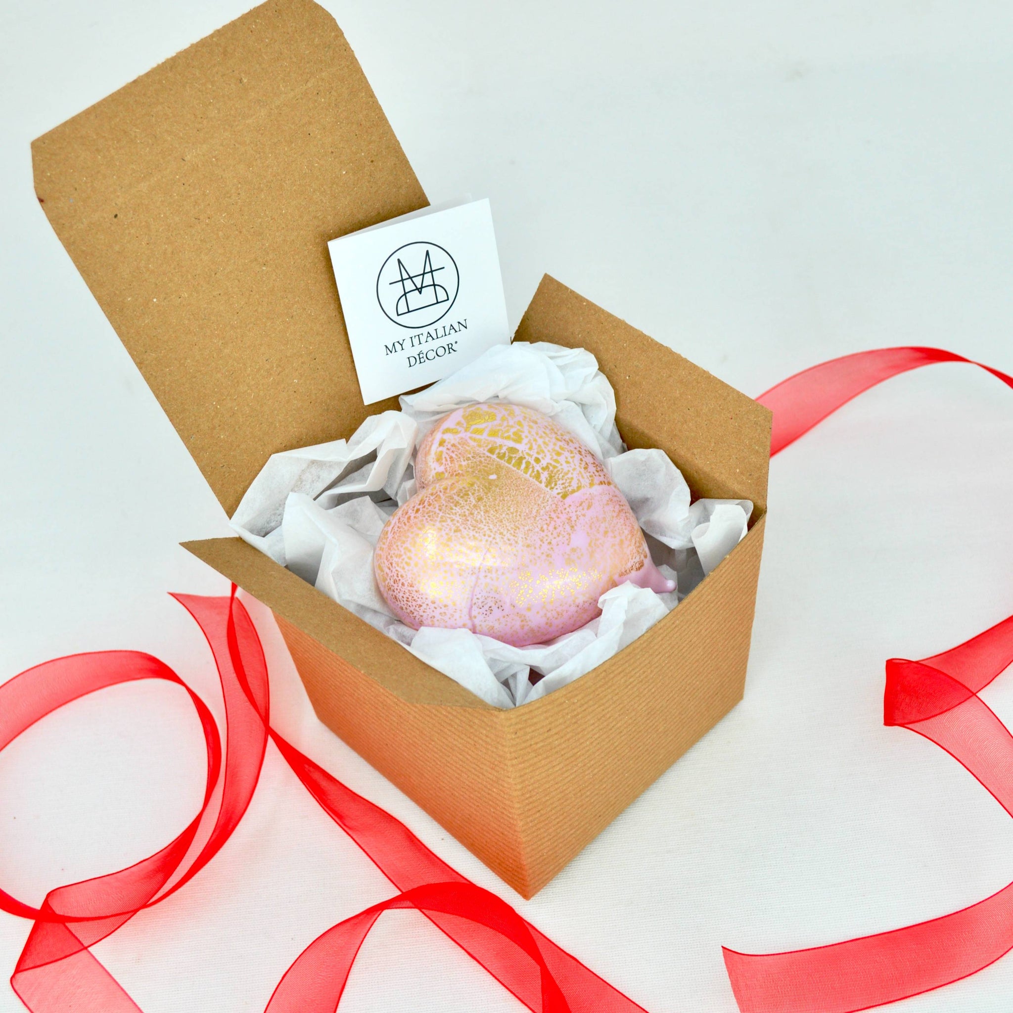 Pastel pink Murano glass heart figurine with 24-karat gold accents, made in Italy, displayed in a box.