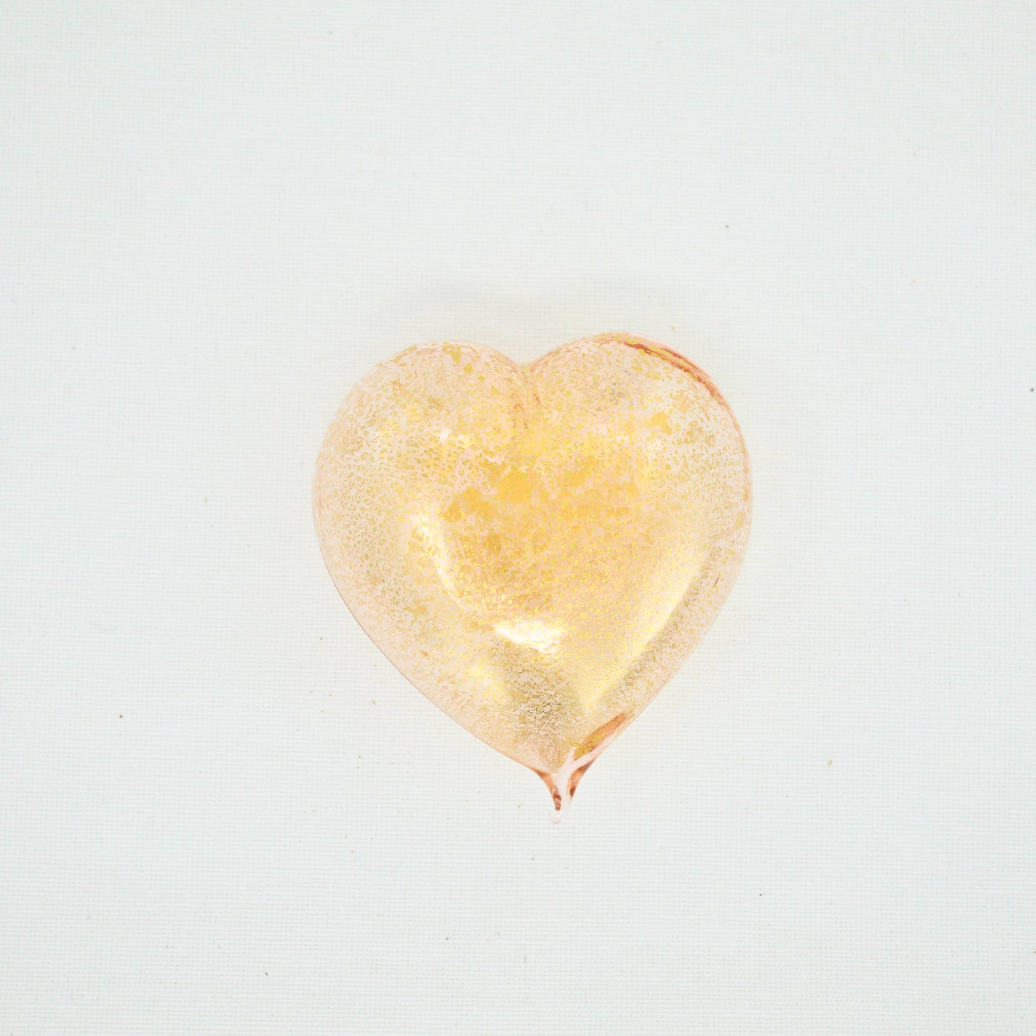 Pink Murano glass heart figurine with 24-karat gold accents, handcrafted in Italy, showcasing vibrant color and intricate glasswork.