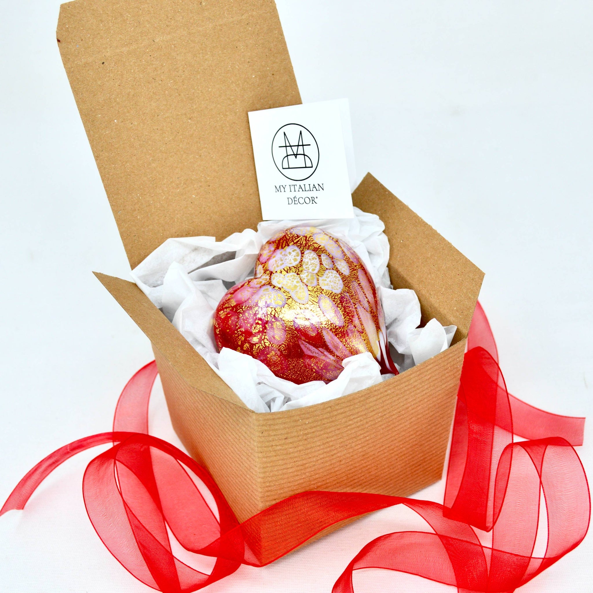 Murano blown glass heart figurine with red and white macchia design and 24 kt gold patina, displayed in a craft box.