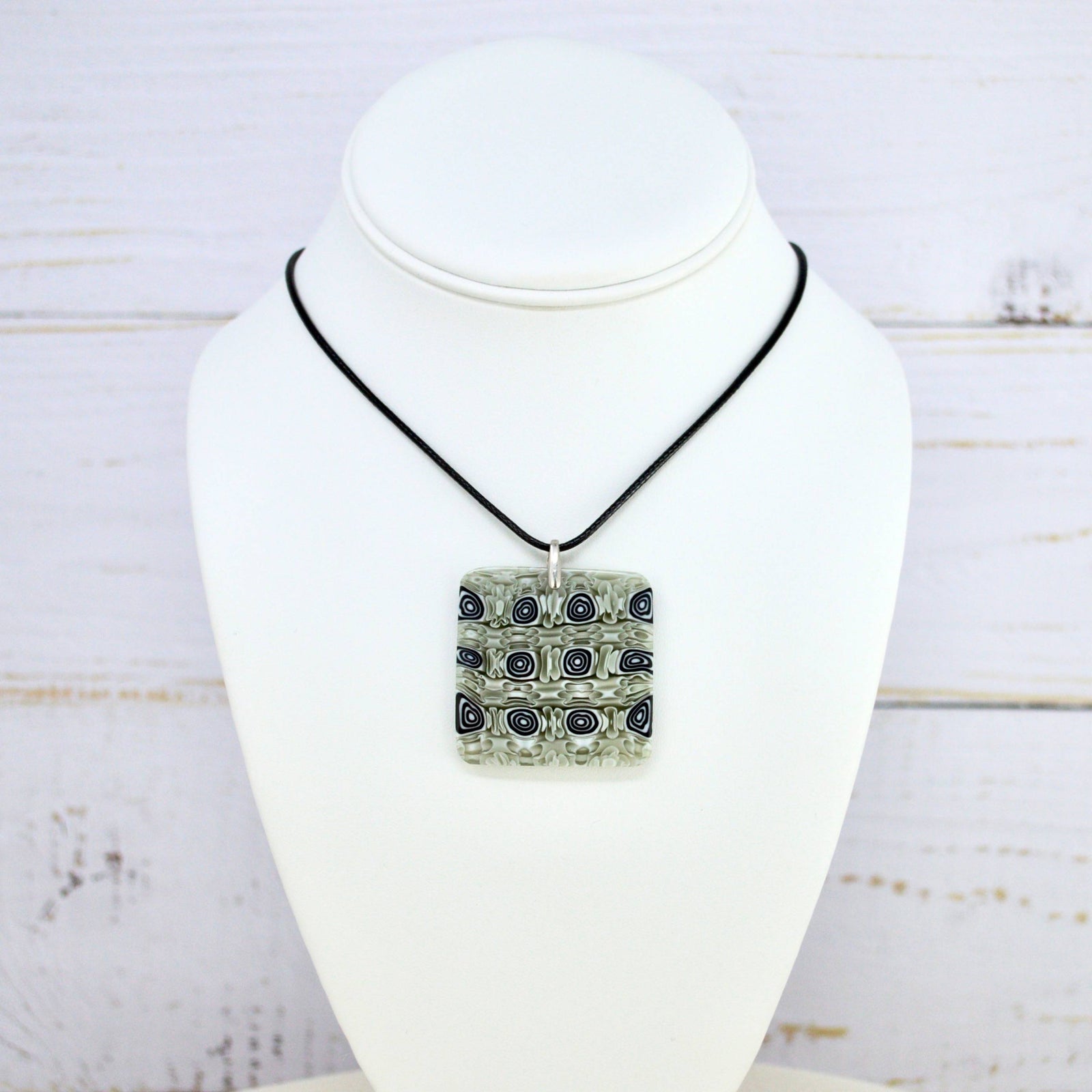 Sage green Murano glass Millefiori mosaic square pendant from Italy, featuring colorful floral patterns on a jewelry charm.