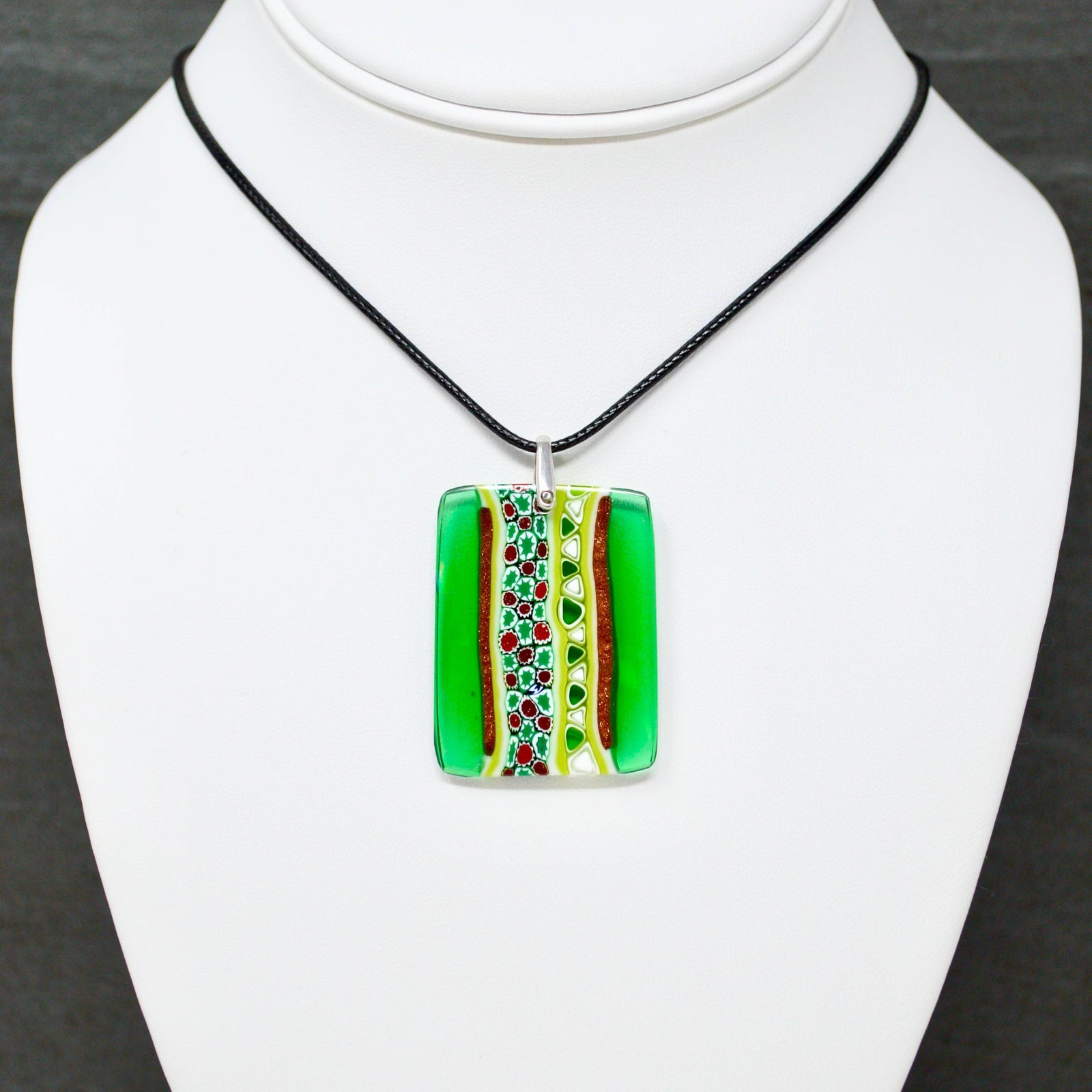 Close-up of Murano Glass Millefiori Mosaic Green Rectangle Pendant, a colorful charm for jewelry making.