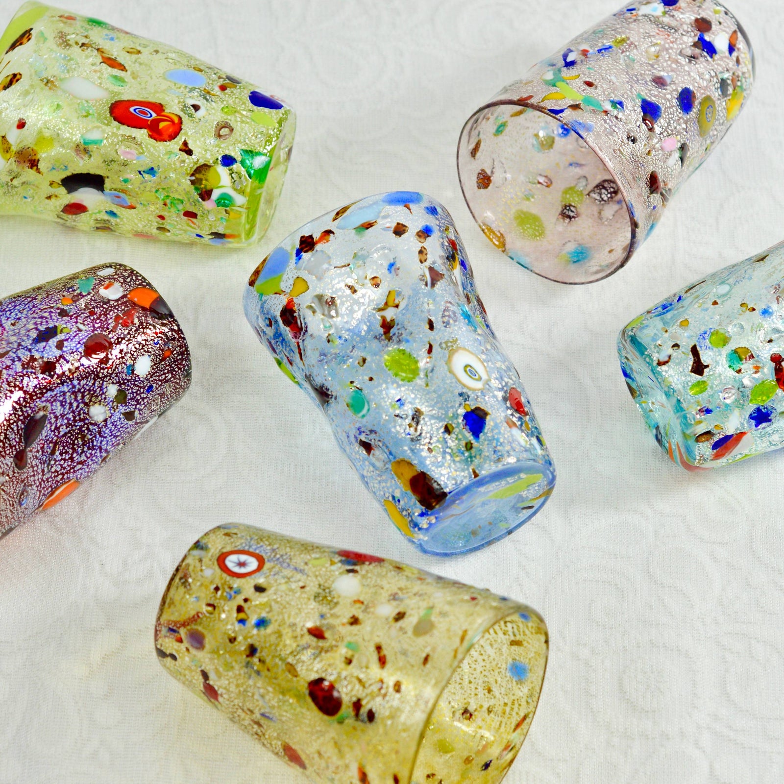 Set of 6 Murano glass tumblers with colorful millefiori designs, crafted by MyItalianDecor, shown from a front view.