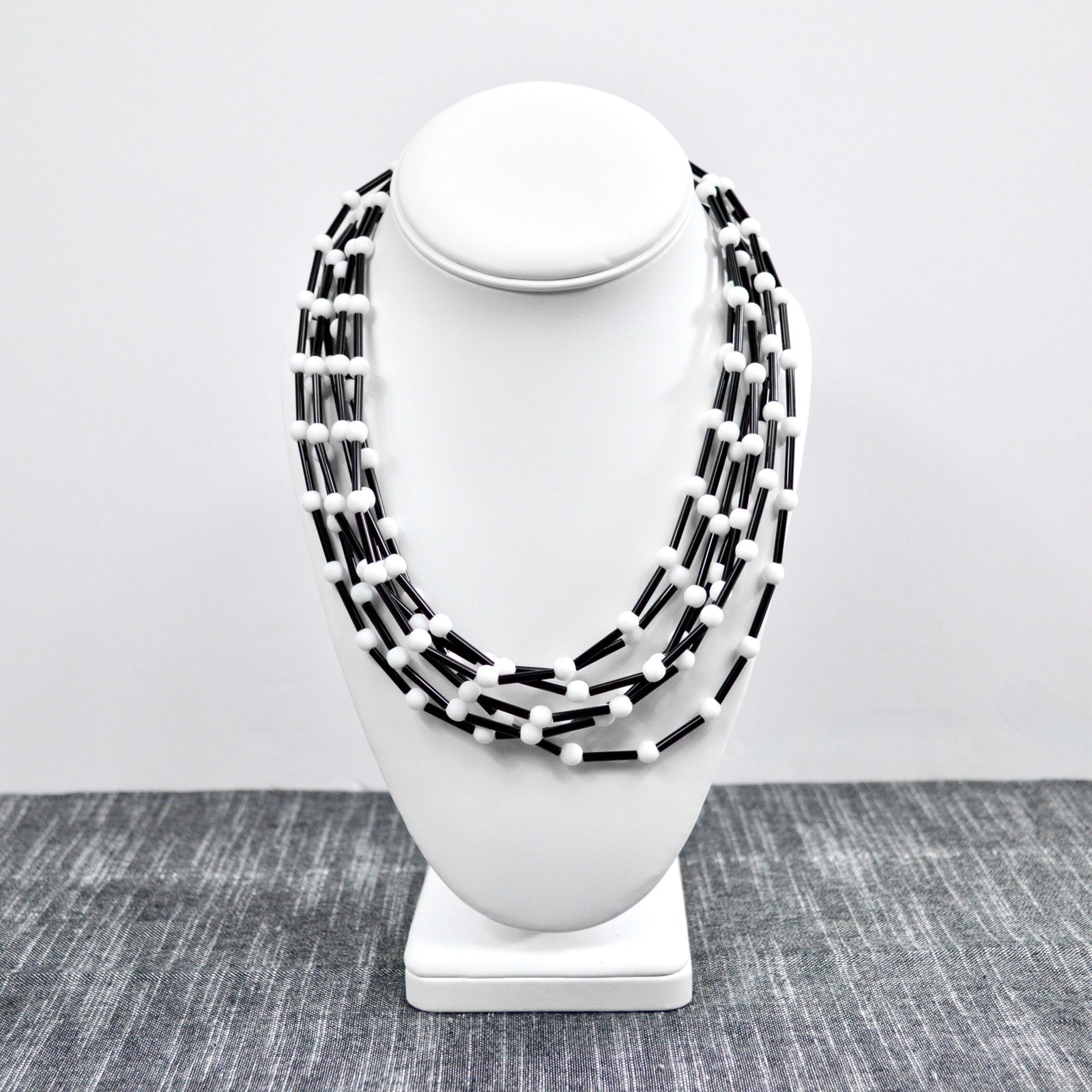 Handmade Murano Glass 'Serafina' beaded necklace in black and white, featuring colorful glass beads, crafted in Italy.