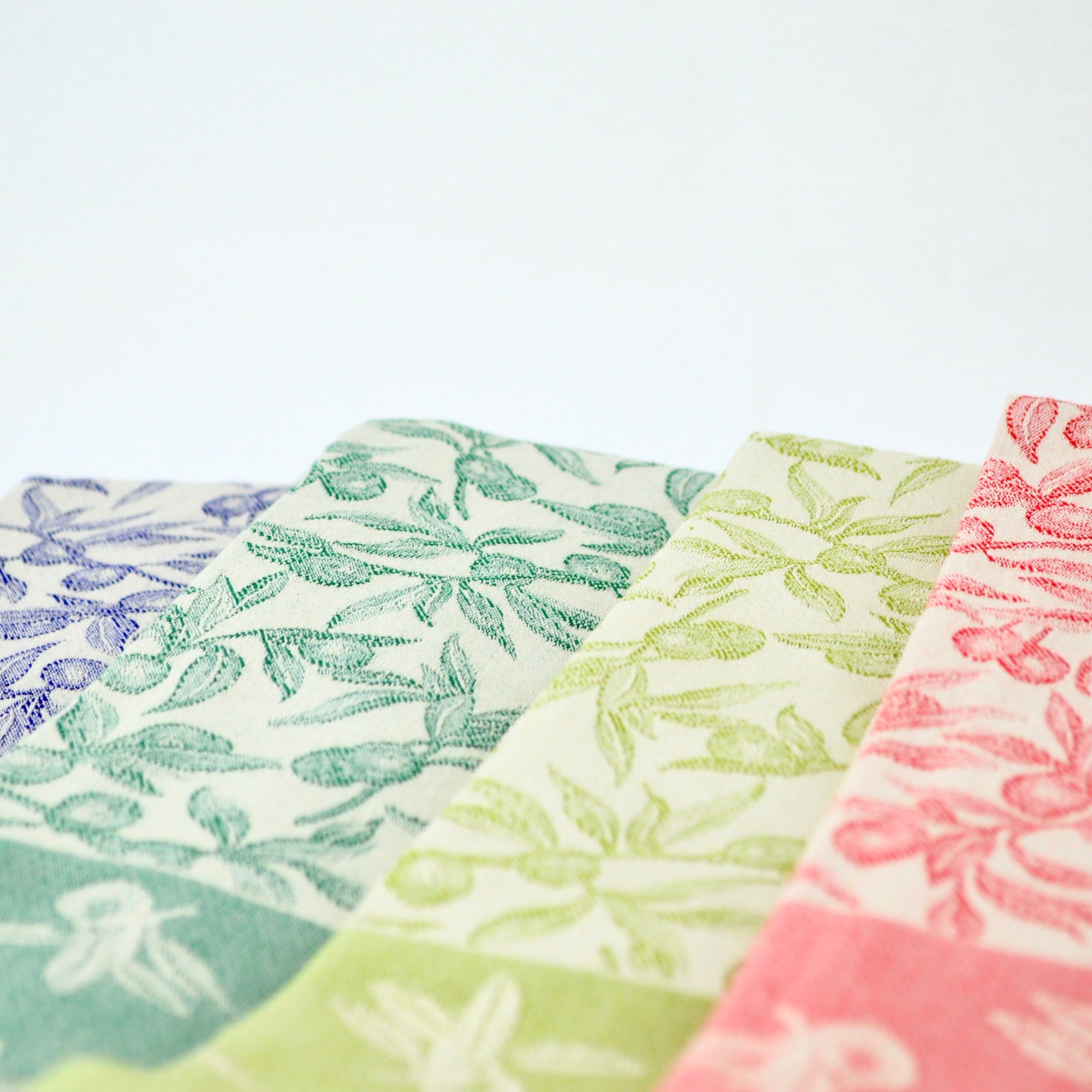 Busatti Oliva kitchen towel set in assorted colors, made in Italy, featuring vibrant, high-quality linen table linens.